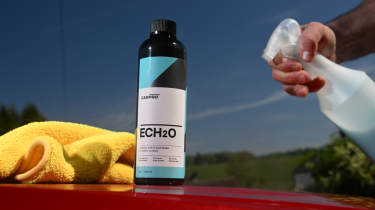 Auto Express products editor Tom Barnard washing a Skoda Superb with CarPro ECH20